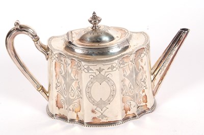 Lot 144 - A Victorian silver teapot of shaped oval form,...