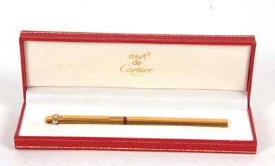 Lot 146 - A Must de Cartier gold plated ballpoint pen No...