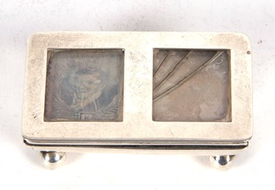 Lot 147 - An antique silver double stamp box of trough...