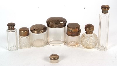 Lot 161 - Group of eight glass dressing table jars with...