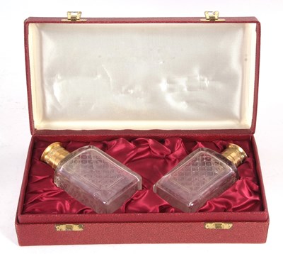 Lot 175 - A cased pair of Asprey & Co cologne bottles,...