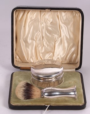 Lot 177 - A late Victorian cased shaving silver handled...