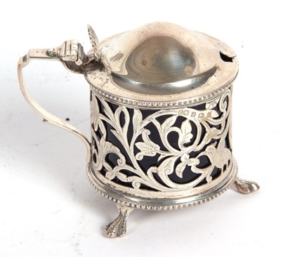 Lot 192 - An Edwardian silver pierced drum mustard, the...