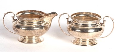 Lot 193 - George V silver cream jug and a twin handled...