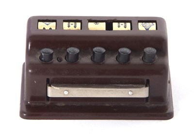 Lot 114A - A vintage poker dice game, a push button...