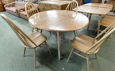 Lot 199 - An Ercol drop leaf circular dining table with...