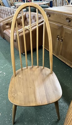 Lot 199 - An Ercol drop leaf circular dining table with...