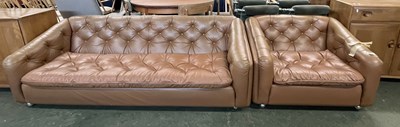 Lot 202 - A mid Century brown leather three seater sofa...