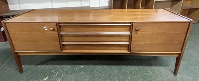 Lot 210 - A mid Century teak sideboard with two end...