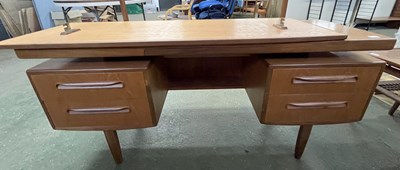 Lot 211 - A mid Century teak dressing table, probably...