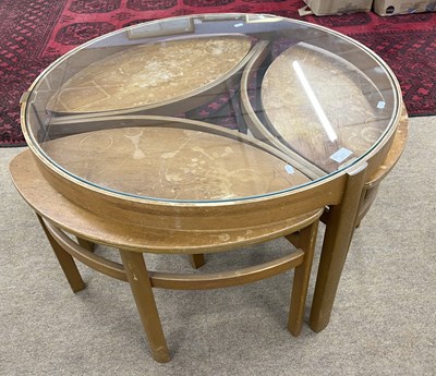 Lot 227 - A Nathan Trinity nest of tables with central...