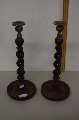 Lot 71 - A pair of oak barley twist candlesticks
