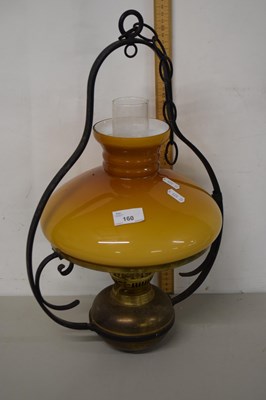 Lot 160 - A brass and iron mounted hanging oil lamp