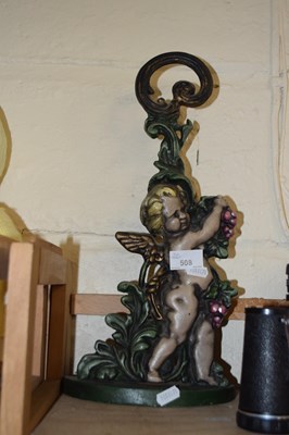 Lot 508 - Cast iron cherub formed candlestick