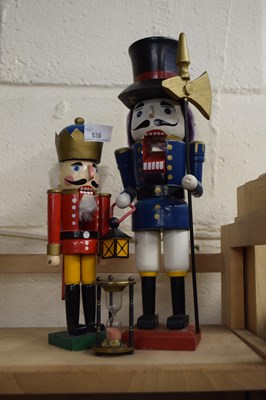 Lot 536 - Two novelty figural nut crackers and an egg timer