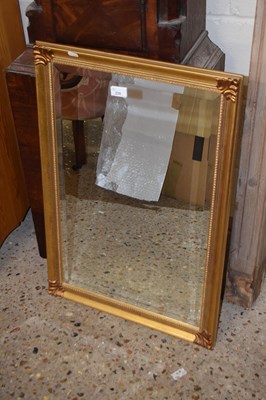 Lot 235 - A modern rectangular gilt framed wall mirror