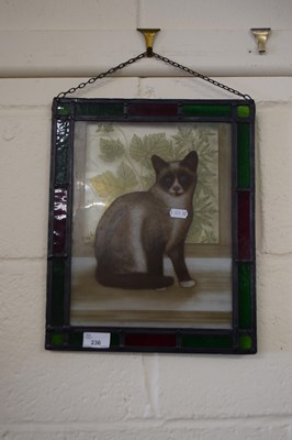 Lot 236 - A lead glazed panel decorated with a cat