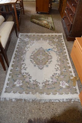 Lot 252 - A Chinese style floral patterned rug