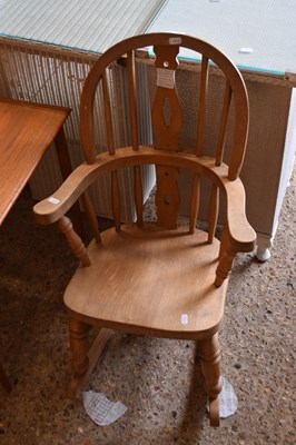 Lot 260 - A child's Windsor style rocking chair, sticker...