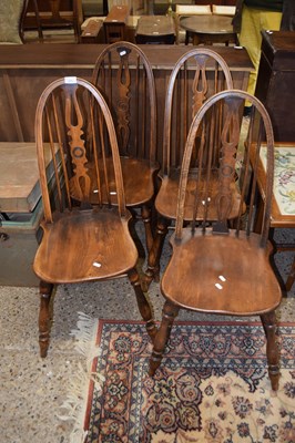 Lot 277 - A set of four elm seat and stick back kitchen...