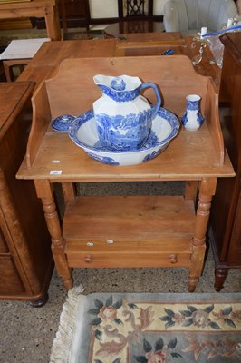 Lot 289 - A pine wash stand containing a blue and white...