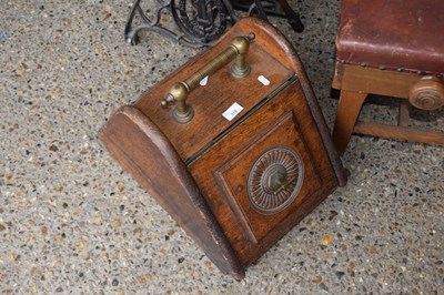 Lot 318 - A late Victorian oak coal box with brass mounts