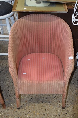 Lot 325 - A Lloyd Loom style pink painted armchair