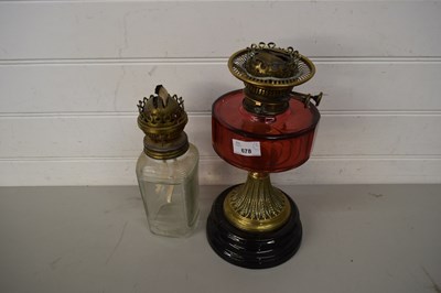 Lot 678 - OIL LAMP WITH CRANBERRY GLASS FONT AND ONE...