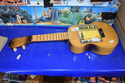 Lot 689 - A ukelele with instruction manual by Jim Dunlop