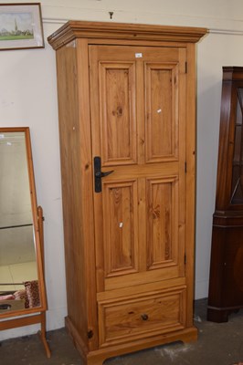 Lot 726 - A modern pine single door wardrobe