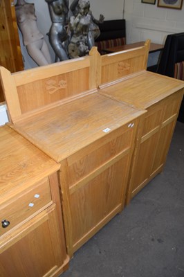 Lot 807 - A pair of open back oak bookcase cabinets