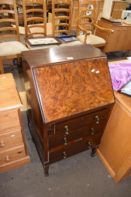 Lot 866 - A walnut veneered bureau