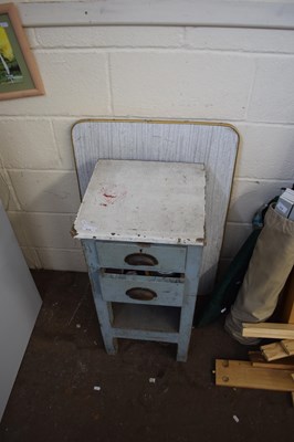 Lot 875 - A small two drawer cabinet and a folding table