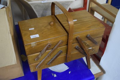 Lot 910 - A cantilever sewing box and contents