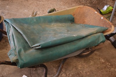 Lot 1087 - A large tarp together with a metal wheelbarrow