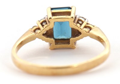 Lot 30 - An 18ct topaz and diamond ring, the...
