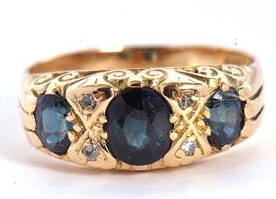 Lot 23 - A sapphire and diamond ring, the three oval...