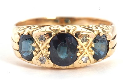 Lot 23 - A sapphire and diamond ring, the three oval...