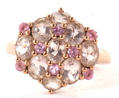 Lot 32 - A 9k pink gemset cluster ring, comprised of...