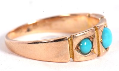 Lot 12 - A 15ct turquoise cabochon ring, the three...