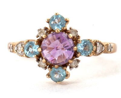 Lot 18 - A 9ct amethyst, topaz and diamond ring, the...