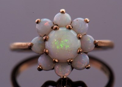 Lot 38 - Two 9ct opal rings, the first an opal cabochon...
