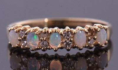 Lot 38 - Two 9ct opal rings, the first an opal cabochon...