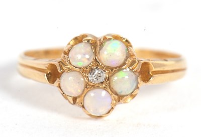Lot 13 - An 18ct opal and diamond cluster ring, set to...