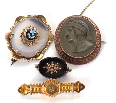 Lot 99 - Four brooches, to include a lava cameo of...