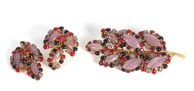 Lot 110 - A 1960's brooch and earrings by Christian Dior,...