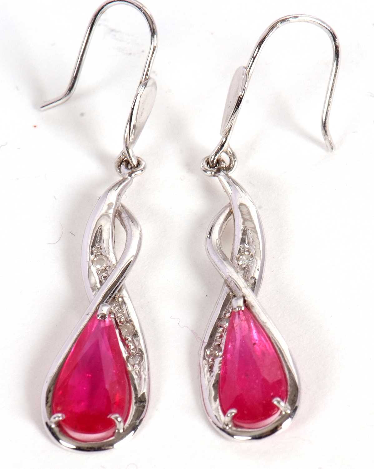 Lot 57 - A pair of 14ct ruby and diamond earrings, the...
