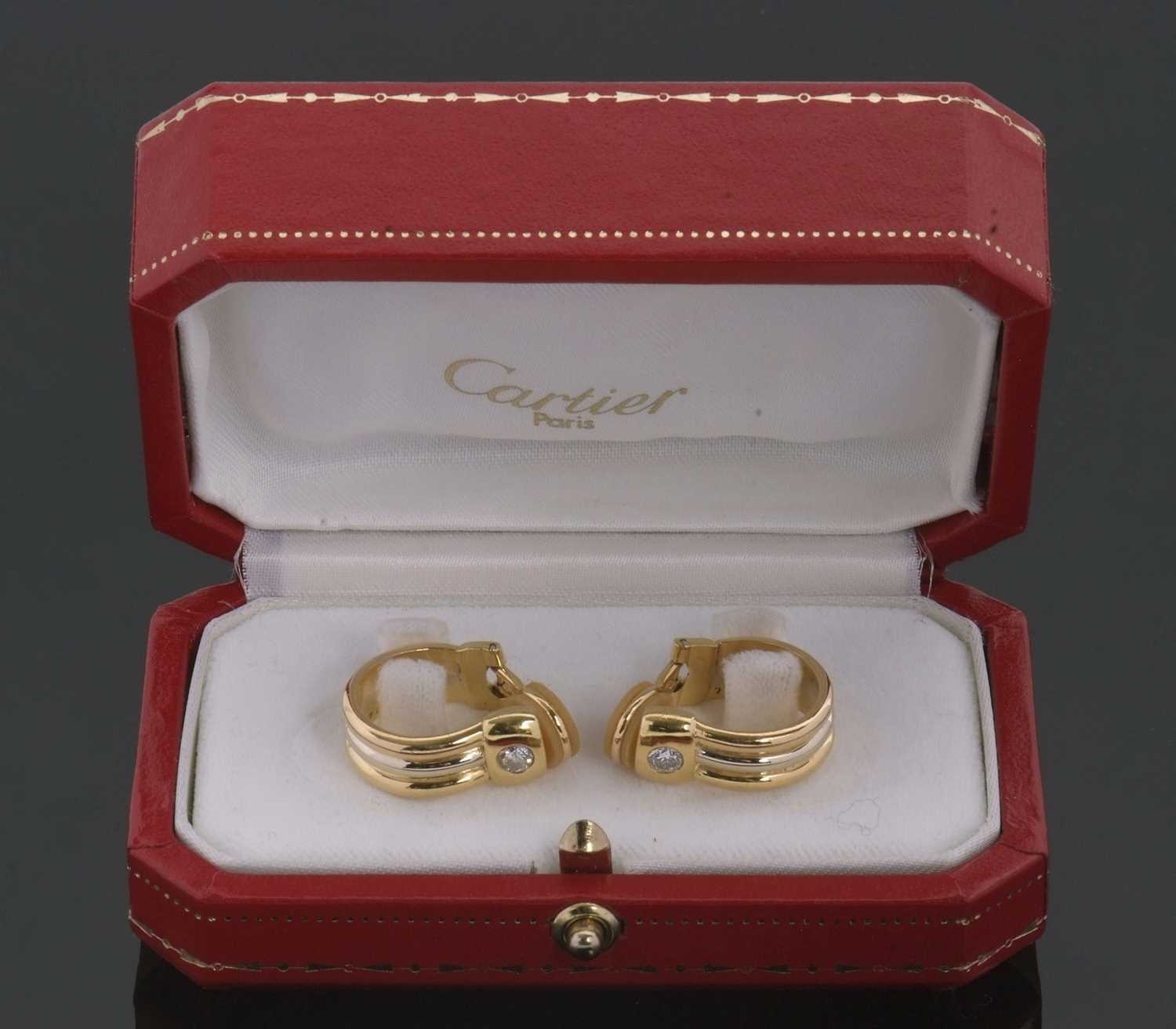 Lot 364 - A pair of Cartier 18ct diamond set earclips,...