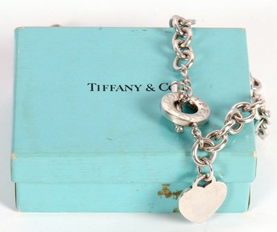 Lot 94 - A Tiffany silver necklace, with heart charm...