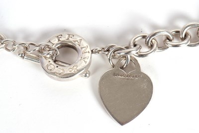 Lot 94 - A Tiffany silver necklace, with heart charm...
